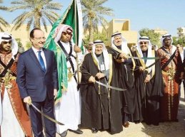 France's Francois Hollande and the Saudis plan Lebanon's future as 2013 draws to a close. (Photo credit: SPA)