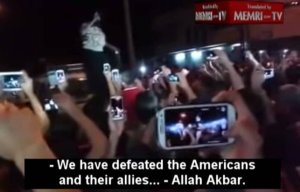Awfully interested in victory over Americans, ISIS is. (Image via MEMRI, from ISIS rally after the fall of Mosul)