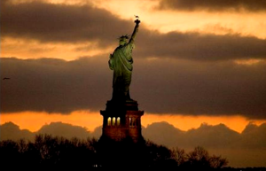 Lady Liberty faces the dawn. (Image: USA Today, Robert Deutsch)
