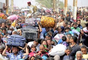 Refugees from a fallen Ramadi clog the roadways outside Baghdad in May 2015. (Image: Corbis vis Newsweek)