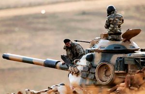Turkish tank patrols the border near Suruc.  (Image: AP via EKurd)